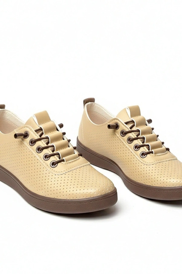 Zandkleurige instap perforatiesportschoenen Adèle 2