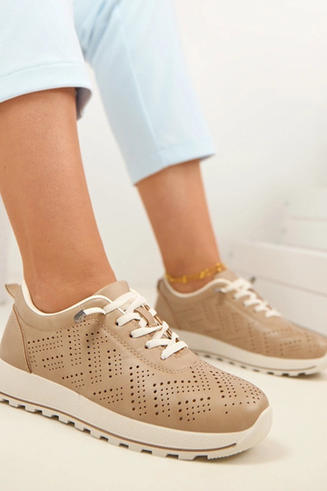 Zandkleurige geperforeerde... 2