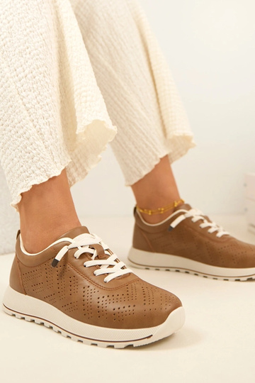 Lichtbruine geperforeerde...