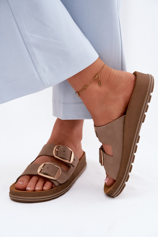Leren slippers met gespen in zandkleur