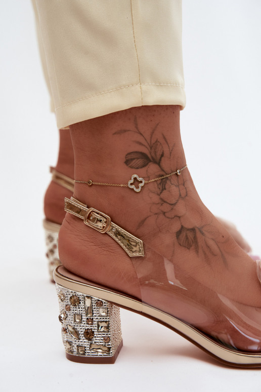 Gouden doorzichtige sandalen met hakken en fonkelende studs D&A