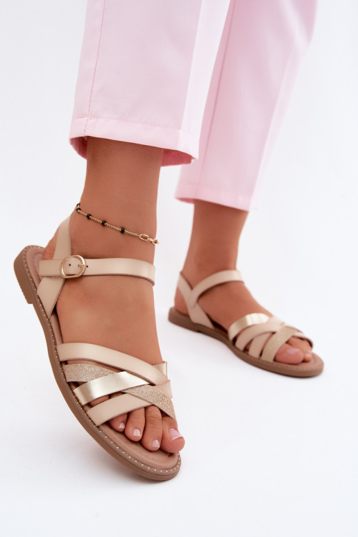 Vlakke dames sandalen met glans en banden in zandkleur Haden
