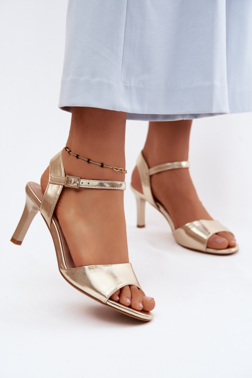 Dames sandalen op een dunne hak in gouden kleur van Sergio Leone