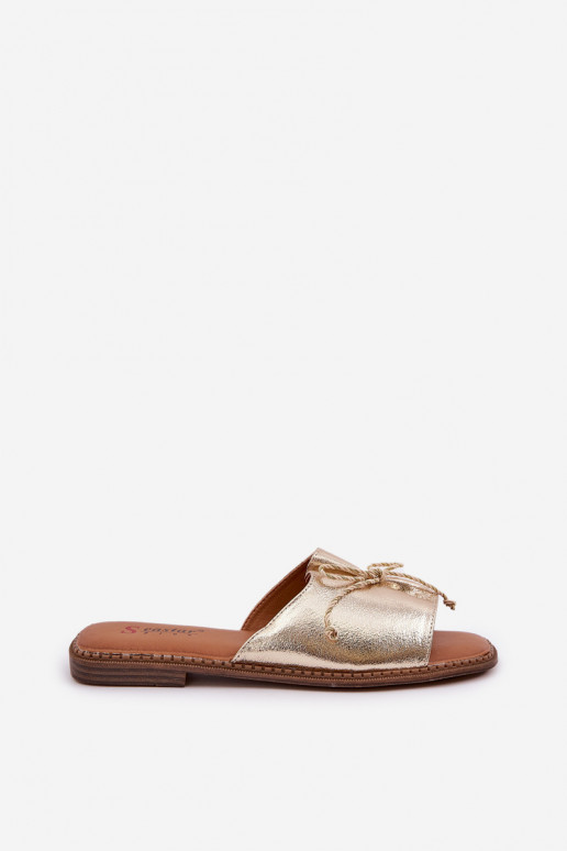 Gouden platte slippers met decoratieve strik Deonelis