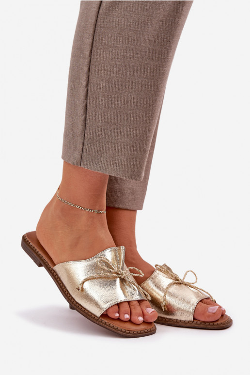 Gouden platte slippers met decoratieve strik Deonelis