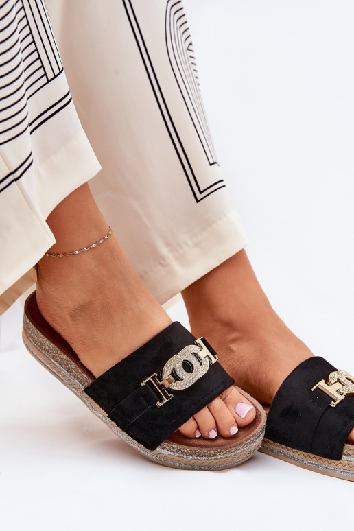 Dames slippers met details op een platform met glans in zwart Eanes