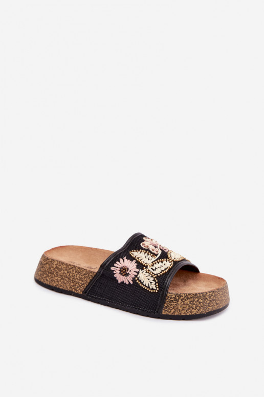 Zwarte dames slippers op een platform met decoratie Ledina