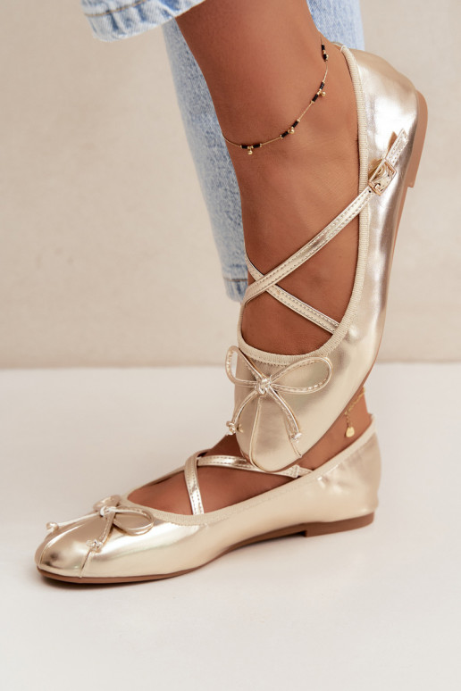 Gouden gelakte ballerina's met lintjes Kokardką