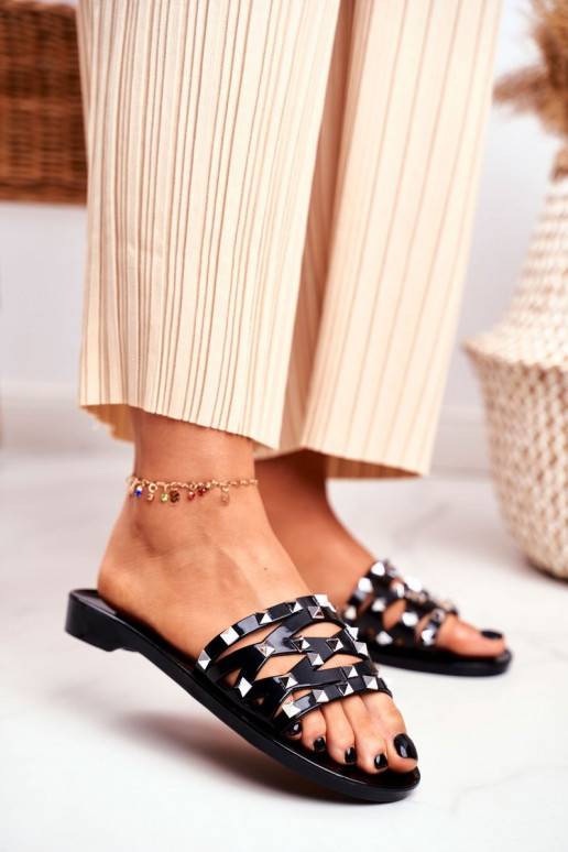 Zwarte rubberen pantoffels met... Zwarte rubberen pantoffels met...