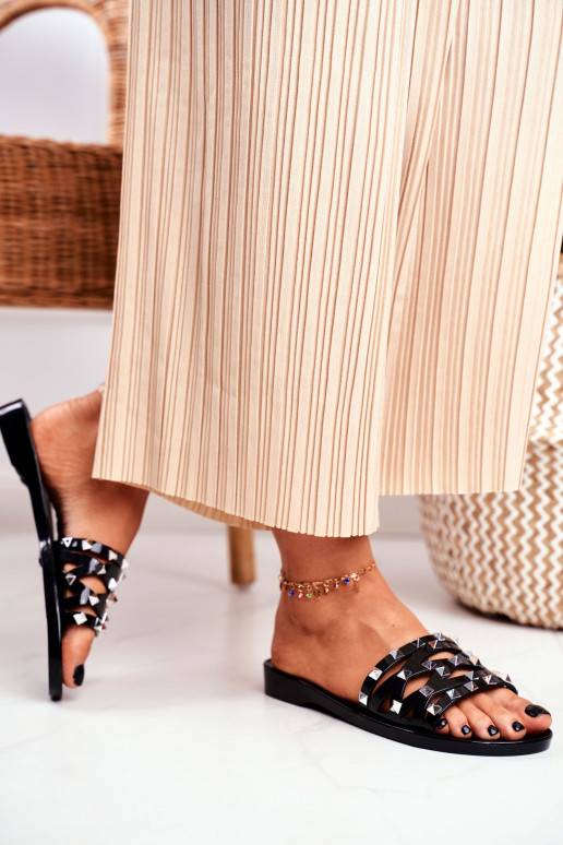 Zwarte rubberen pantoffels met... Zwarte rubberen pantoffels met...