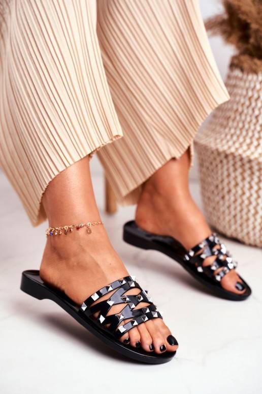 Zwarte rubberen pantoffels met... Zwarte rubberen pantoffels met...