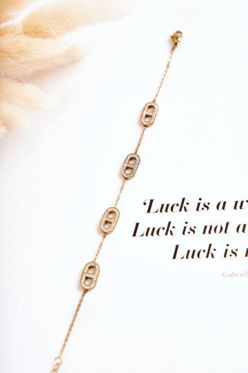 Damesarmband met fonkelende ogen in goudkleur