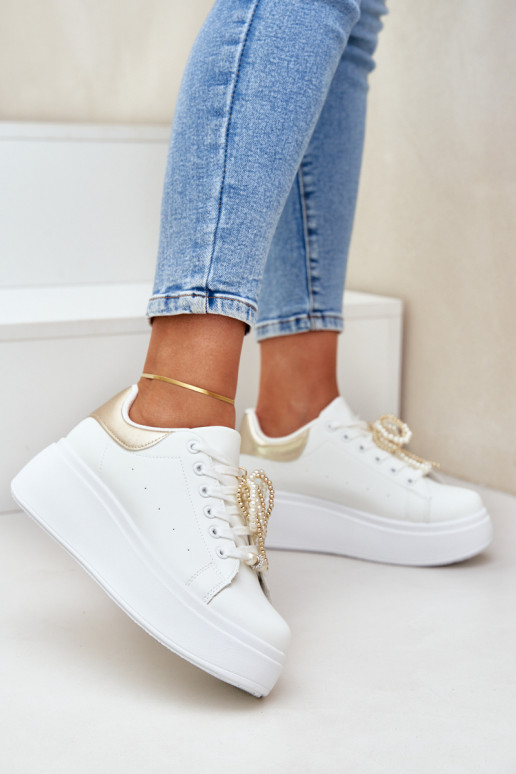 Sneakers model schoenen Dames met platform met mooie details INit-gouden kleur Lerissna