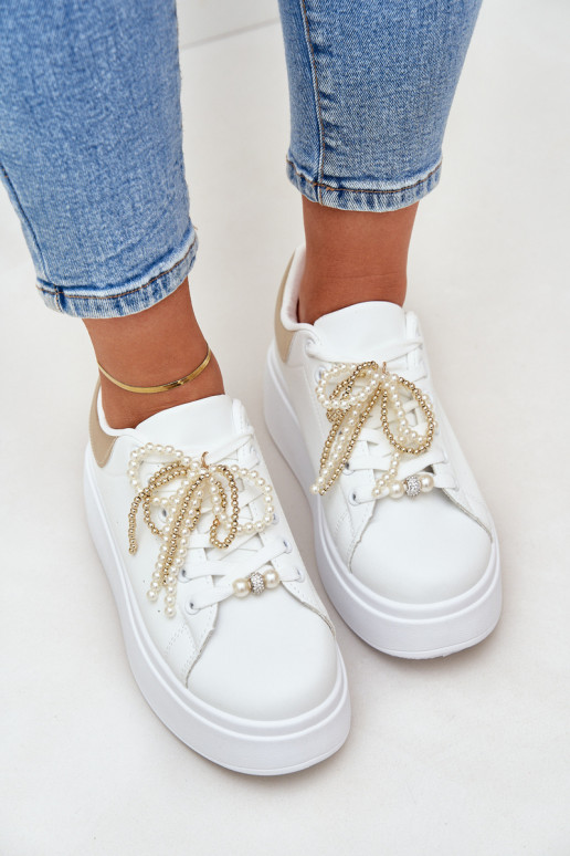 Sneakers model schoenen Dames met platform met mooie details INit-gouden kleur Lerissna