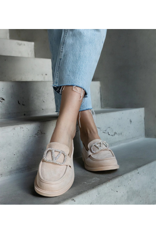 Beige mokkasiner dekoreret med...