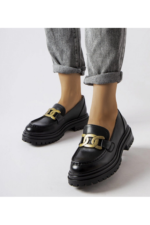 Sorte loafers dekoreret med et...