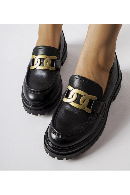 Sorte loafers dekoreret med et...