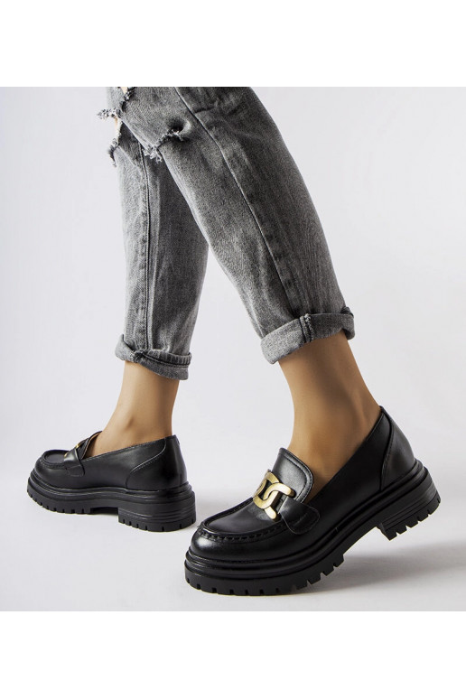 Sorte loafers dekoreret med et...