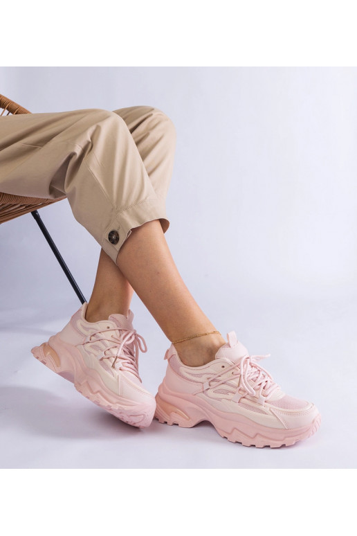 Lyserøde sportssneakers med en massiv...