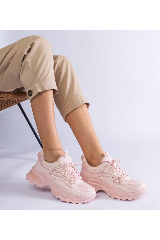 Lyserøde sportssneakers med en massiv...