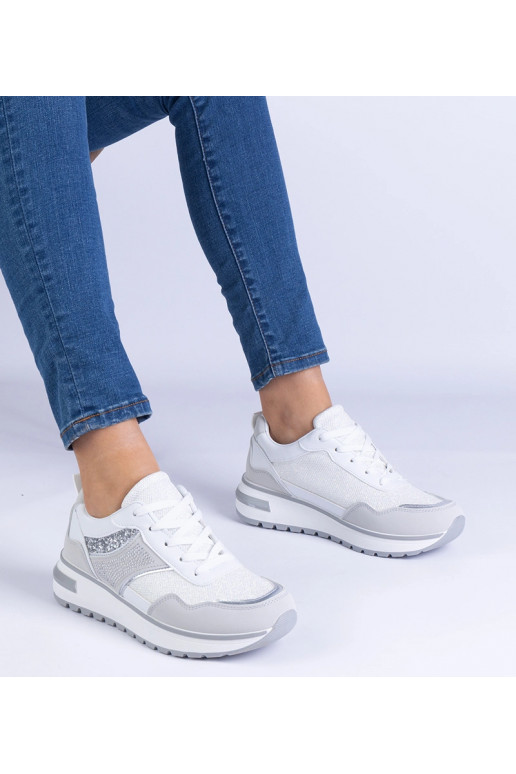 Witte sneakers versierd met glitter...